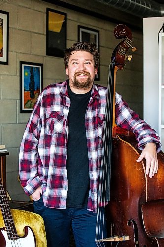 MIKAELA MACKENZIE / WINNIPEG FREE PRESS

Winnipeg bass player Devon Gillingham with both his string and electric basses on Wednesday, Nov. 22, 2023. For Al Small story.
Winnipeg Free Press 2023.