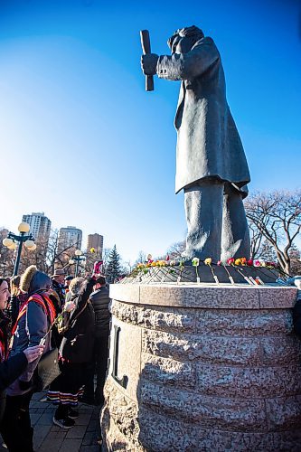 MIKAELA MACKENZIE / WINNIPEG FREE PRESS

Metis citizens place roses at the foot of the Louis Riel statue (after the introduction of legislation naming Louis Riel as the honourary first premier of Manitoba was announced) at the legislative building on Thursday, Nov. 23, 2023. For Danielle story.
Winnipeg Free Press 2023.