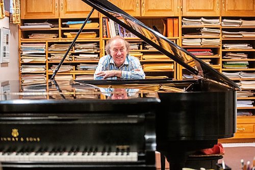 MIKAELA MACKENZIE / WINNIPEG FREE PRESS

John Melnyk with his signed Steinway piano on Thursday, Nov. 23, 2023. For Holly Harris story.
Winnipeg Free Press 2023.