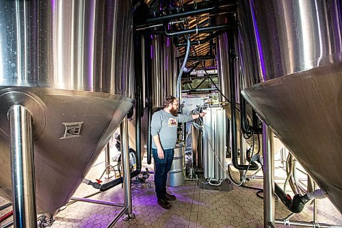 MIKAELA MACKENZIE / WINNIPEG FREE PRESS

Head of brewery operations Rob McWhinney shows components of the new CiCi Carbon Recapture System in their fermentation vat area at the Little Brown Jug brewery on Tuesday, Nov. 21, 2023. 
Winnipeg Free Press 2023.