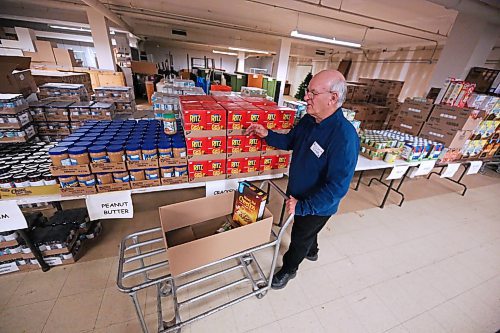 Brandon-Westman Christmas Cheer volunteer Jim Cobb begins packing up Christmas hampers on Friday afternoon at the organization's Rosser Avenue office in preparation for the start of hamper deliveries on Monday. The organization is still looking for volunteer drivers to help with deliveries of 1,100 hampers next week. If you're unable to volunteer your time, however, perhaps consider a donation today for the Fill the Bus Campaign which starts today at Sobeys West. From 10 a.m. to 5 p.m. a City of Brandon Transit bus will be parked at the grocery store parking lot, accepting non-perishable food and toy donations for the Christmas Cheer Registry. If you miss donating today, the bus will also be parked at Safeway in the Corral Centre on Saturday, Dec. 2. (Matt Goerzen/The Brandon Sun)