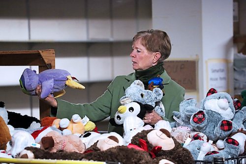 Nancy DeRoo with Knox United Church searches through extra plush toys at the Brandon-Westman Christmas Cheer Board office on Rosser Avenue to help fill 22 holiday hampers being offered through the church. (Matt Goerzen/The Brandon Sun)