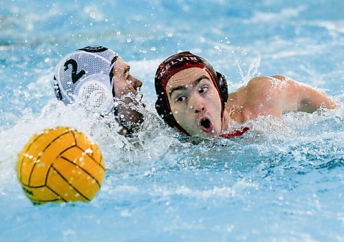 JOHN WOODS / WINNIPEG FREE PRESS
Kelvin High School&#x2019;s Charlie Omalley (7) and Vincent Massey Collegiate&#x2019;s Henry Suffield (2) chase down a ball  in the Manitoba Schools Water Polo League gold medal game at the Pan Am pool in Winnipeg Sunday, November  26, 2023. Vincent Massey went on to win the championship game.

Reporter: Josh