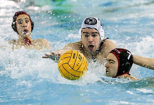 JOHN WOODS / WINNIPEG FREE PRESS
Kelvin High School&#x2019;s Charlie Omalley (7) and Vincent Massey Collegiate&#x2019;s Henry Suffield (2) chase down a ball  in the Manitoba Schools Water Polo League gold medal game at the Pan Am pool in Winnipeg Sunday, November  26, 2023. Vincent Massey went on to win the championship game.

Reporter: Josh