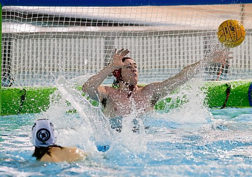 JOHN WOODS / WINNIPEG FREE PRESS
Kelvin High School&#x2019;s goaltender Eric Kavanagh (1) can&#x2019;t stop the shot from Vincent Massey Collegiate&#x2019;s Lex Mackin (3) in the Manitoba Schools Water Polo League gold medal game at the Pan Am pool in Winnipeg Sunday, November  26, 2023. Vincent Massey went on to win the championship game.

Reporter: Josh