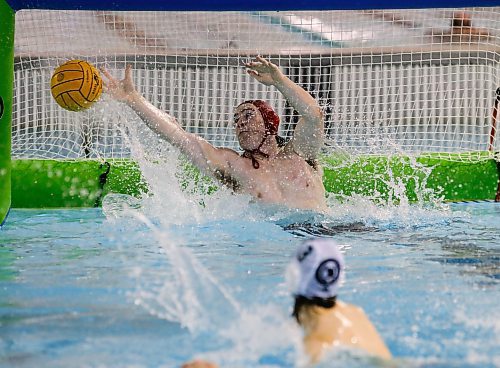 JOHN WOODS / WINNIPEG FREE PRESS
Kelvin High School&#x2019;s goaltender Eric Kavanagh (1) can&#x2019;t stop the shot from Vincent Massey Collegiate&#x2019;s Lex Mackin (3) during the shootout in the Manitoba Schools Water Polo League gold medal game at the Pan Am pool in Winnipeg Sunday, November  26, 2023. Vincent Massey went on to win the championship game.

Reporter: Josh