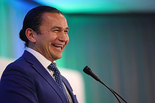 Manitoba Premier Wab Kinew laughs at one of his own jokes during a speech to delegates at the Association of Manitoba Municipalities conference at the Keystone Centre in Brandon on Tuesday afternoon. (Matt Goerzen/The Brandon Sun)