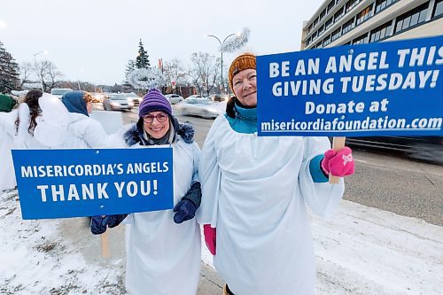 MIKE DEAL / WINNIPEG FREE PRESS
Susan Barsky (left) and Dayle Harding (right) are both volunteers at the Misericordia Health Centre whose shift starts right after they finish volunteering in the Angel Squad.
A host of Angels dressed in gowns, wings and halos, daubed the &#x201c;Angel Squad&#x201d; line the Northbound stretch of the Maryland Street Bridge during the 28th anniversary of Misericordia Health Centre Foundation&#x2019;s fundraiser that takes place on Giving Tuesday.
231128 - Tuesday, November 28, 2023.