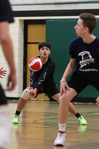 Kingston Thomas digs a ball during Neelin Spartans varsity boys volleyball practice on Tuesday, ahead of this weekend's AAA provincials in Dauphin. (Thomas Friesen/The Brandon Sun)