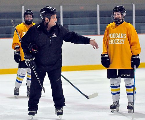 ACC Cougars coach Tony Bertone explains his breakout drill to forward Brooklyn Franklin, while Virden's Emma Ramsay watches from the blue-line.
(Photos by Jules Xavier/The Brandon Sun)