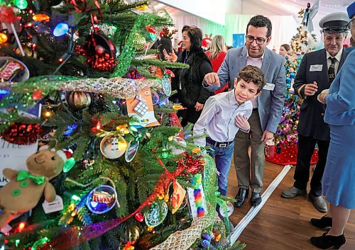 RUTH BONNEVILLE / WINNIPEG FREE PRESS

LOCAL STDUP - Trees of Joy, Make-A-Wish  

Make-A-Wish Canada hosts the 2nd Annual Trees of Joy fundraising campaign with 14 sponsored trees for 14 wish kids at the Gates on Wednesday.  

Photo of Tiago Moranda (10yrs) with his dad, Roger, checking out his Tree of Joy.  

The 14 corporate tree sponsors customized their tree with their child's specific interests in mind to spark joy in the child's heart as they hunted for their tree in a visually striking, holiday forest. 

The event was attended by the child's families, friends and sponsors to raise funds for children with critical illnesses to have their wishes come true  Each of the trees will be delivered to wish families&#x560;homes to enjoy throughout the holiday season and every tree will represent another wish granted to another child by a corporate partner.


Nov 29th,, 2023