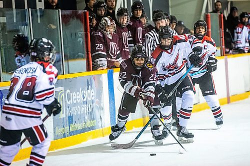 MIKAELA MACKENZIE / WINNIPEG FREE PRESS

Westwood Warrior Carter Shabaga (22) and College Beliveau Barracuda Quin Gannon (29) battle for the puck at the Keith Bodley Arena on Wednesday, Nov. 29, 2023. For sports story.
Winnipeg Free Press 2023.