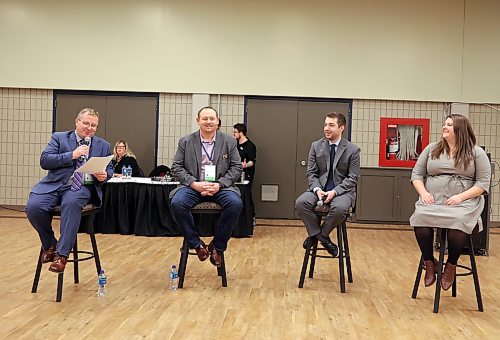 Swan River Mayor Lance Jacobson (left) introduces panellists for a discussion on short-term rentals at the second day of the Association of Manitoba Municipalities at Brandon's Keystone Centre on Wednesday morning. He was joined by Municipality of Harrison Park Reeve Ian Drul (centre-left), Manitoba Hotel Association president Michael Juce (centre-right) and Airbnb policy director Alex Howell (right). (Colin Slark/The Brandon Sun)