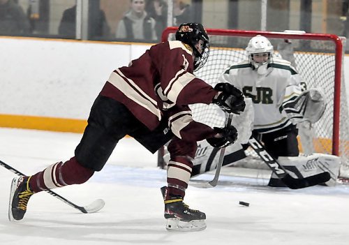 Crocus sniper Gilbert Teneycke found the five-hole to beat St. John's Ravenscourt goalie Max Gillman during third-period action at Flynn Arena. The Plainsmen dropped an 8-6 decision to the Eagles on the opening day of the 24-team Victoria Inn high school hockey tournament.
(Photos by Jules Xavier/The Brandon Sun)