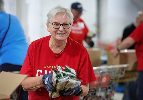 RUTH BONNEVILLE / WINNIPEG FREE PRESS

Local -  Christmas Cheerboard Story

Photo of longtime volunteer, Sheila Worboys, helping volunteers as they pack food hampers at the Christmas Cheer warehouse Thursday. 

Feature at the warehouse speaking to volunteers on the sense of community that they feel.
 
CHEER BOARD: Every year the Cheer Board sets up for the massive undertaking of receiving, building and sending out over 18,000 hampers to families in need. Before the phone lines even open, volunteers have already been busy for weeks building a functional warehouse space, receiving food, setting up different work areas. 

See TAYLOR'S Story. 

Nov 30th,, 2023