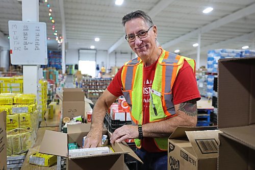 RUTH BONNEVILLE / WINNIPEG FREE PRESS

Local -  Christmas Cheerboard Story

Photo of longtime volunteer, Rick Gill, warehouse operations manager, setting up sample hampers Thursday. 

Feature at the warehouse speaking to volunteers on the sense of community that they feel.
 
CHEER BOARD: Every year the Cheer Board sets up for the massive undertaking of receiving, building and sending out over 18,000 hampers to families in need. Before the phone lines even open, volunteers have already been busy for weeks building a functional warehouse space, receiving food, setting up different work areas. 

See TAYLOR'S Story. 

Nov 30th,, 2023