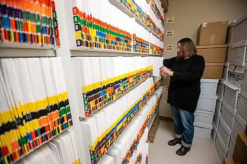 MIKAELA MACKENZIE / WINNIPEG FREE PRESS

Jenn Bogoch with their secure filing area, which now helps unhoused folks store I.D. in a safe spot, at SEED Winnipeg on Friday, Dec. 1, 2023. For Josh story.
Winnipeg Free Press 2023.