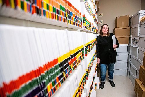 MIKAELA MACKENZIE / WINNIPEG FREE PRESS

Jenn Bogoch with their secure filing area, which now helps unhoused folks store I.D. in a safe spot, at SEED Winnipeg on Friday, Dec. 1, 2023. For Josh story.
Winnipeg Free Press 2023.