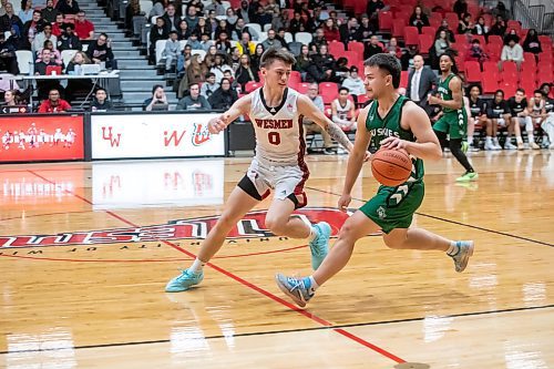 BROOK JONES / WINNIPEG FREE PRESS
The University of Winnipeg Wesmen play host to the visiting University of Saskatchewan Huskties in Canada West men's basketball action inside the Dr. David F. Anderson Gymnasium at the Duckworth Centre at the University of Winnipeg in Winnipeg, Man., Friday, Dec. 1, 2023. Pictured: Winnipeg Wesmen guard Kato Jaro (No. 0) guards Saskatchewan Huskies guard Tyrese Potoma (right) during second quarter action. 