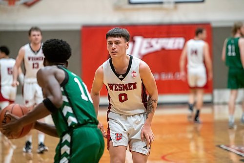 BROOK JONES / WINNIPEG FREE PRESS
The University of Winnipeg Wesmen play host to the visiting University of Saskatchewan Huskties in Canada West men's basketball action inside the Dr. David F. Anderson Gymnasium at the Duckworth Centre at the University of Winnipeg in Winnipeg, Man., Friday, Dec. 1, 2023. Pictured: Winnipeg Wesmen guard Kato Jaro (No. 0) guards Saskatchewan Huskies guard Fisayo Moibi (No. 10) during second quarter action.
