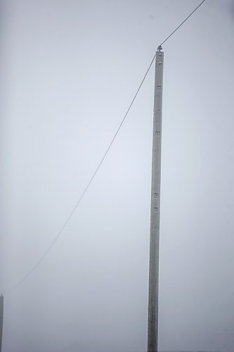 MIKAELA MACKENZIE / WINNIPEG FREE PRESS

Frosty rural power lines disappear into the fog near Morris on Monday, Dec. 4, 2023. For JS hydro story.
Winnipeg Free Press 2023