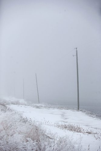 MIKAELA MACKENZIE / WINNIPEG FREE PRESS

Frosty rural power lines disappear into the fog near Morris on Monday, Dec. 4, 2023. For JS hydro story.
Winnipeg Free Press 2023