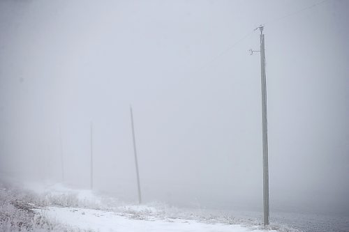 MIKAELA MACKENZIE / WINNIPEG FREE PRESS

Frosty rural power lines disappear into the fog near Morris on Monday, Dec. 4, 2023. For JS hydro story.
Winnipeg Free Press 2023