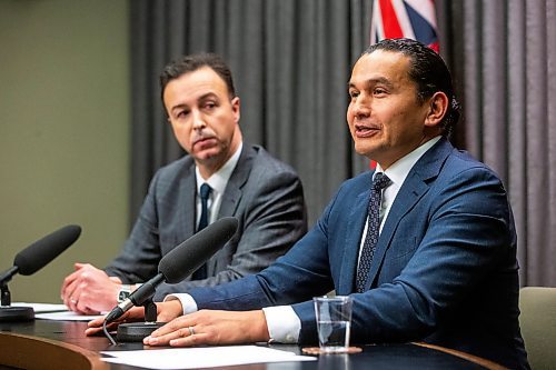 Premier Wab Kinew (right) and finance minister Adrien Sala speak to the media about the finances left to them by the previous government at the Manitoba Legislative Building on Tuesday, Dec. 5. (Mikaela MacKenzie/Winnipeg Free Press)
