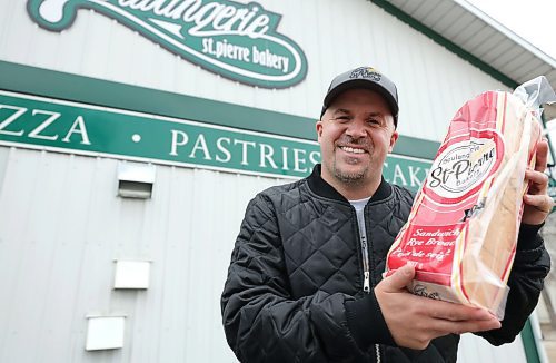 RUTH BONNEVILLE / WINNIPEG FREE PRESS

INTERSECTION - St.Pierre Bakery

Photo of Joe Gagne, owner Boulangerie St-Pierre Bakery, in  St-Pierre-Jolys, outside the Bakery with one of their popular loaves of breads. 

Story: This is for an Intersection piece on the St-Pierre Bakery, which has been cranking out loaves of bread, cinnamon buns and tourtiere for close to a century. 

Joe, the present owner, took over from his parents a few years ago; his dad started working there in the '80s, and bought the bakery in 1992 (owner previous to the Gagnes, a fellow named Norm, had it from the mid-60s to the early '90s, 
(Photo of all three in the original building with staff working in the background)

They turn out as many as 1,800 loaves of bread an hour, it's a hopping place. Also photos of pastries, storefront - customers, workers and outside shot of building.  


See Dave's story. 

Dec 5th,  2023