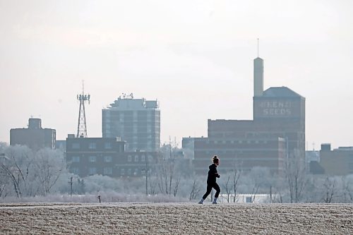 04122023
A runner out for a jog is framed by hoar-frost covered trees and the downtown Brandon skyline at the Riverbank Discovery Centre on Tuesday. (Tim Smith/The Brandon Sun)