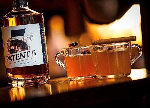 JOHN WOODS / WINNIPEG FREE PRESS
Patent 5 Distillery bar manager Nick Drescher has developed a spiced cider drink for the Christmas season and mixed it up in the Alexander Avenue bar Tuesday, December 5, 2023. 

Reporter: eva