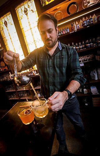 JOHN WOODS / WINNIPEG FREE PRESS
Patent 5 Distillery bar manager Nick Drescher has developed a spiced cider drink for the Christmas season and mixed it up in the Alexander Avenue bar Tuesday, December 5, 2023. 

Reporter: eva