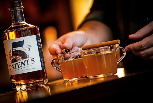 JOHN WOODS / WINNIPEG FREE PRESS
Patent 5 Distillery bar manager Nick Drescher has developed a spiced cider drink for the Christmas season and mixed it up in the Alexander Avenue bar Tuesday, December 5, 2023. 

Reporter: eva