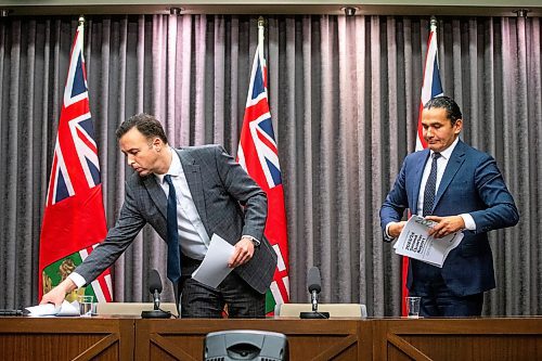 Finance Minister Adrien Sala (left) and Premier Wab Kinew gather their papers after speaking to the media about the finances left to them by the previous conservative government at the Manitoba Legislative Building on Tuesday, Dec. 5. (Mikaela Mackenzie/Winnipeg Free Press)