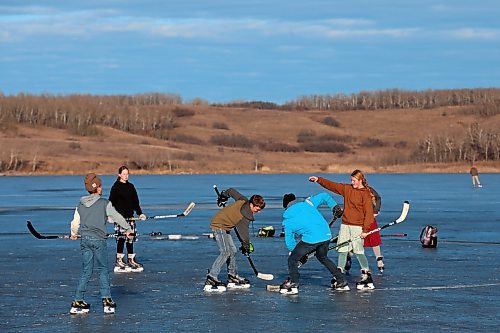 Brandon Sun photographer Tim Smith captured some scenes of old-fashioned lake hockey on a balmy Wednesday afternoon as students from Assiniboine Valley Christian School took to the ice on Lake Clementi. Environment Canada is calling for snow in Brandon on Friday. (Tim Smith/The Brandon Sun)