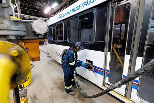 MIKE DEAL / WINNIPEG FREE PRESS
Rhenan fills up a bus with diesel fuel while he does the vehicles daily service maintenance.
The Winnipeg Transit Service and Maintenance buildings at 421 Osborne Street.
See AV Kitching story
231205 - Tuesday, December 05, 2023.