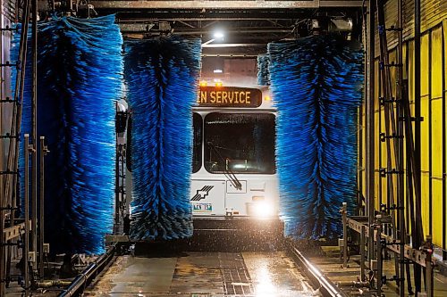 MIKE DEAL / WINNIPEG FREE PRESS
A transit bus goes through one of two automatic bus washers Tuesday morning. The fleet of almost 600 buses gets washed at this facility everyday. 
Winnipeg Transit Service and Maintenance buildings at 421 Osborne Street.
See AV Kitching story
231205 - Tuesday, December 05, 2023.