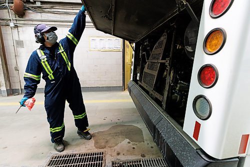 MIKE DEAL / WINNIPEG FREE PRESS
Rhenan opens up the engine compartment to check the oil levels while he does the vehicles daily service maintenance.
The Winnipeg Transit Service and Maintenance buildings at 421 Osborne Street.
See AV Kitching story
231205 - Tuesday, December 05, 2023.