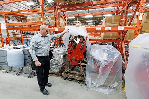 MIKE DEAL / WINNIPEG FREE PRESS
Don Glowatsky, Manager, Plant and Equipment, Winnipeg Transit, lifts a plastic sheet off a refurbished engine in the Maintenance building.
The Winnipeg Transit Service and Maintenance buildings at 421 Osborne Street.
See AV Kitching story
231205 - Tuesday, December 05, 2023.