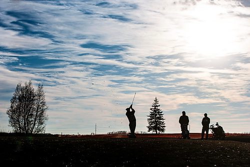 MIKAELA MACKENZIE / WINNIPEG FREE PRESS
	
Golfers Philip Da Silva (left), Nick Mulvey, and Brian Stover play at the Southside Golf Course, which is open in December for the first time ever due to the unusually mild weather, on Thursday, Dec. 7, 2023. 
Winnipeg Free Press 2023