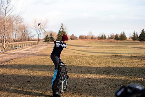 MIKAELA MACKENZIE / WINNIPEG FREE PRESS
	
Cameron Langedock tees off at the Southside Golf Course, which is open in December for the first time ever due to the unusually mild weather, on Thursday, Dec. 7, 2023. 
Winnipeg Free Press 2023