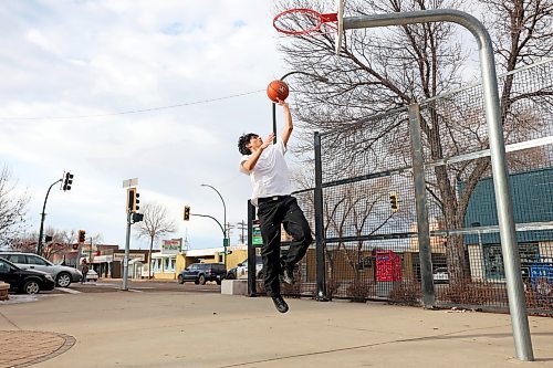 07122023
Manan Singh practices his hoop skills at the basketball net outside the Brandon YMCA in a t-shirt on an unseasonably mild Thursday. 
(Tim Smith/The Brandon Sun)