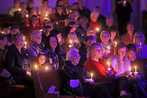07122023
Attendees hold lit candles burning in memory of loved ones who have passed away during the Brockie Donovan Tree of Memories 26th Annual Community Candlelight Memorial Service at the McDiarmid Drive Alliance Church on Thursday evening.    (Tim Smith/The Brandon Sun)