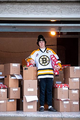 MIKAELA MACKENZIE / WINNIPEG FREE PRESS
	
Tyden Lafournaise with Christmas Cheer Board hampers ready to be delivered by him and his Winnipeg Bruins teammates this weekend on Friday, Dec. 8, 2023.
Winnipeg Free Press 2023