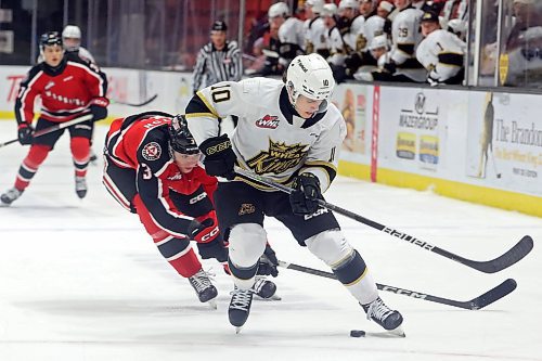 08122023
Caleb Hadland #10 of the Brandon Wheat Kings keeps the puck ahead of Lucas Brenton #3 of the Moose Jaw Warriors during WHL action at Westoba Place on Friday evening.
(Tim Smith/The Brandon Sun)