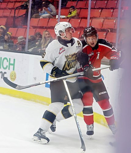 08122023
Quinn Mantei #8 of the Brandon Wheat Kings checks Jagger Firkus #27 of the Moose Jaw Warriors into the glass during WHL action at Westoba Place on Friday evening.
(Tim Smith/The Brandon Sun)