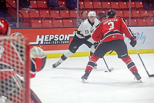 08122023
Roger McQueen #13 of the Brandon Wheat Kings tries to get the puck around Lucas Brenton #3 of the Moose Jaw Warriors during WHL action at Westoba Place on Friday evening.
(Tim Smith/The Brandon Sun)