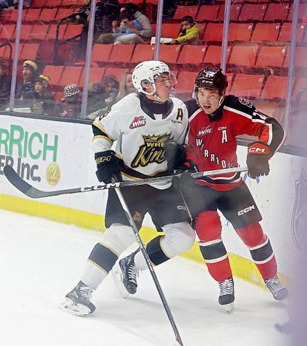 08122023
Quinn Mantei #8 of the Brandon Wheat Kings checks Jagger Firkus #27 of the Moose Jaw Warriors into the glass during WHL action at Westoba Place on Friday evening.
(Tim Smith/The Brandon Sun)