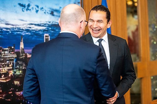 MIKAELA MACKENZIE / WINNIPEG FREE PRESS
	
Mayor Scott Gillingham and premier Wab Kinew shake hands at the unveiling of Bowman&#x573; mayoral portrait at City Hall on Monday, Dec. 11, 2023.
Winnipeg Free Press 2023