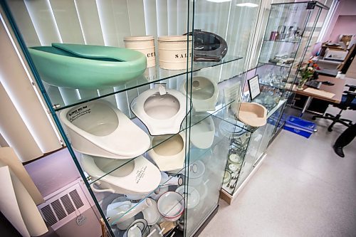 MIKAELA MACKENZIE / WINNIPEG FREE PRESS
	
A small collection of bedpans at the Health Science&#x2019;s Centre archives on Monday, Dec. 11, 2023. Students at Brandon University took the bedpans on as research projects. For Dave Sanderson story.
Winnipeg Free Press 2023